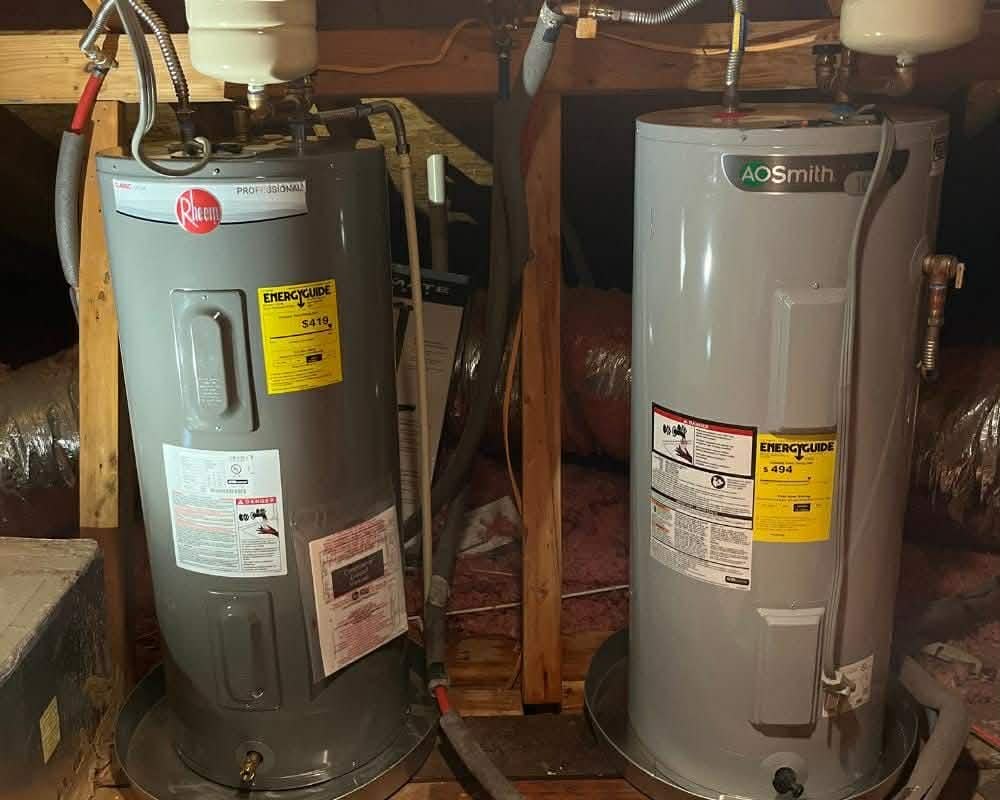 Two tank water heaters installed side by side